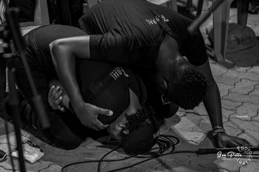 Two worship leaders praying together