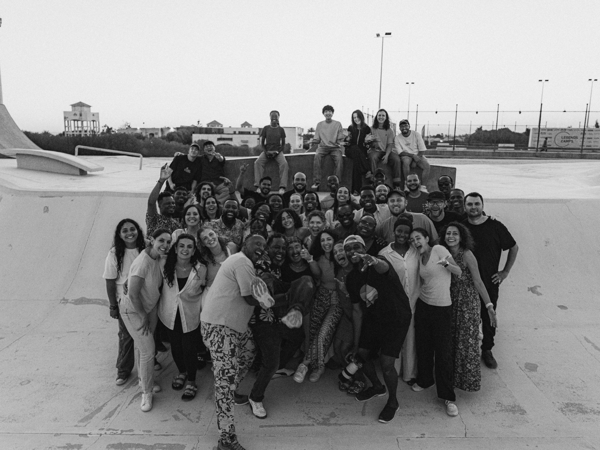A global community of worship leaders gathered together outdoors.